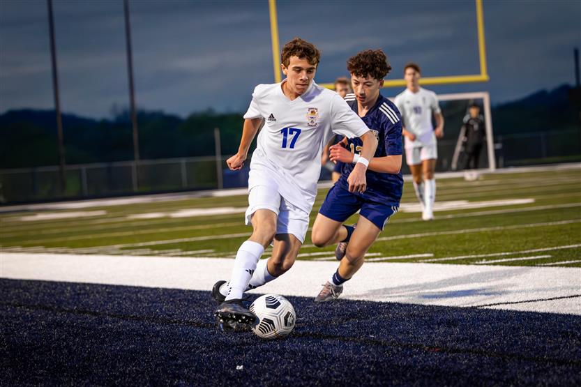 Students play soccer